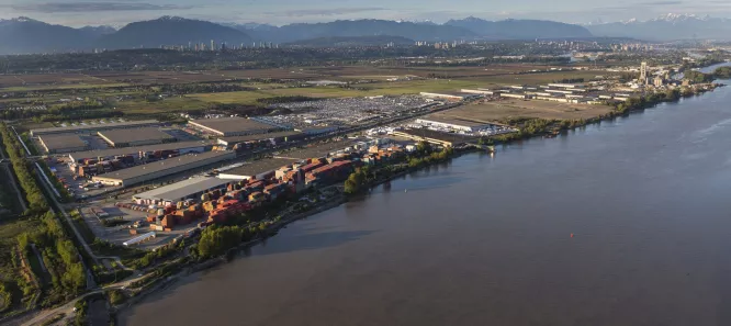 An industrial area sits on the banks of the river