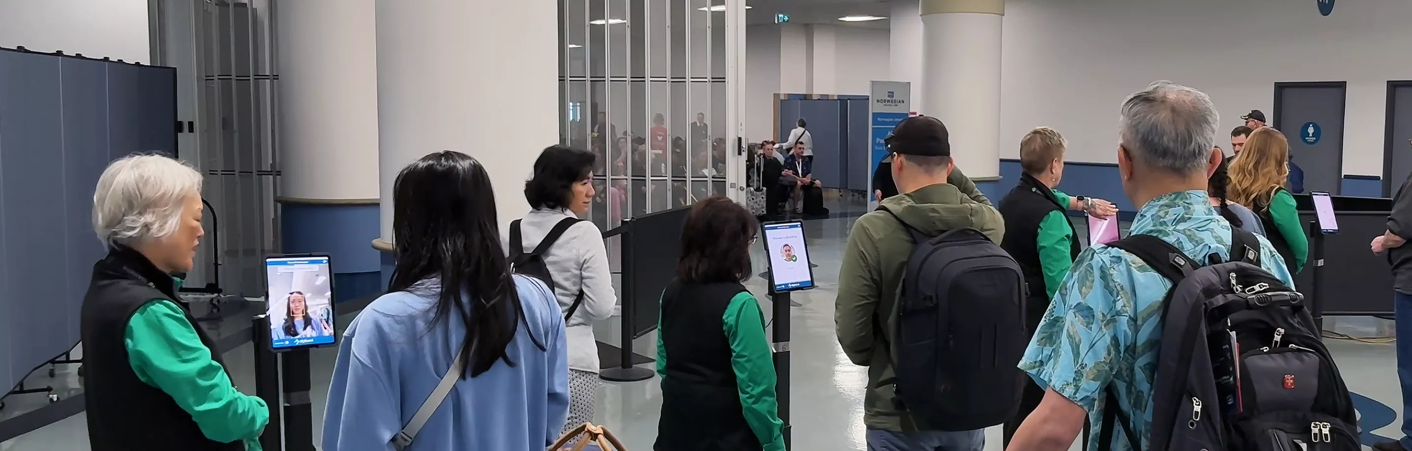 Cruise passengers lining up for facial scanning