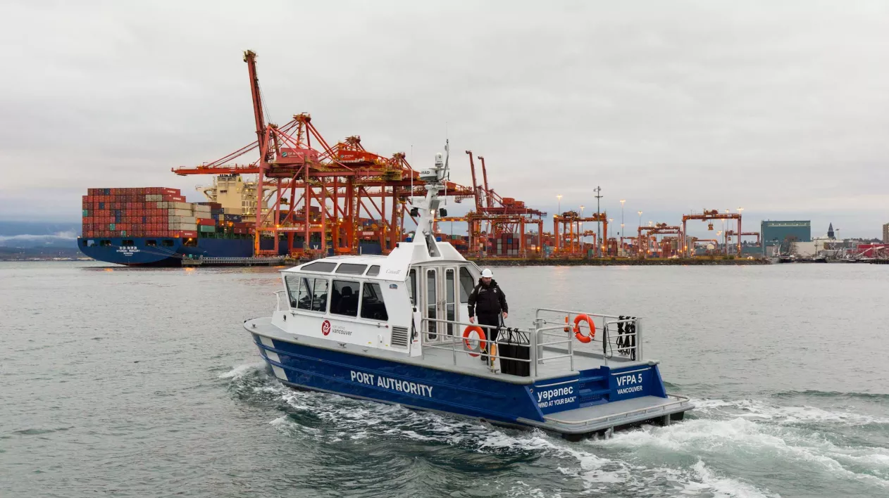 Photo of a harbour patrol boat and Centerm Container Terminal 