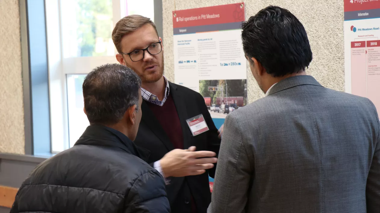 Photo of three people at a public engagement session