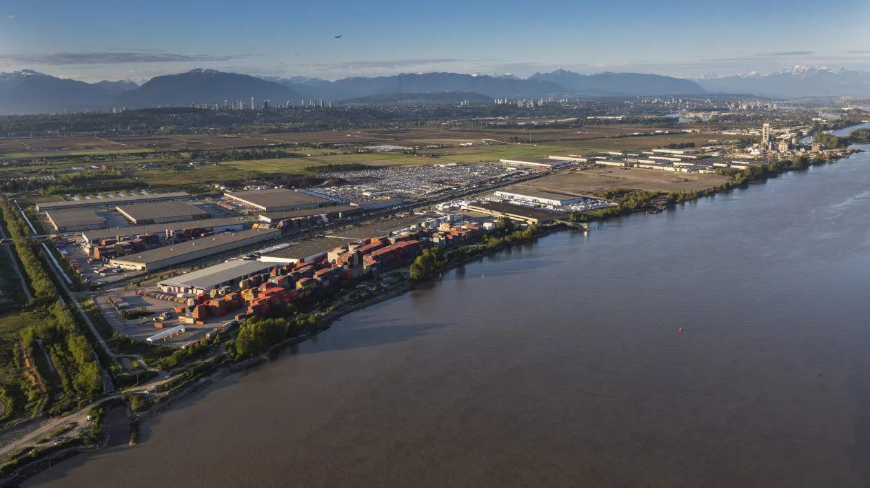 An industrial area sits on the banks of the river